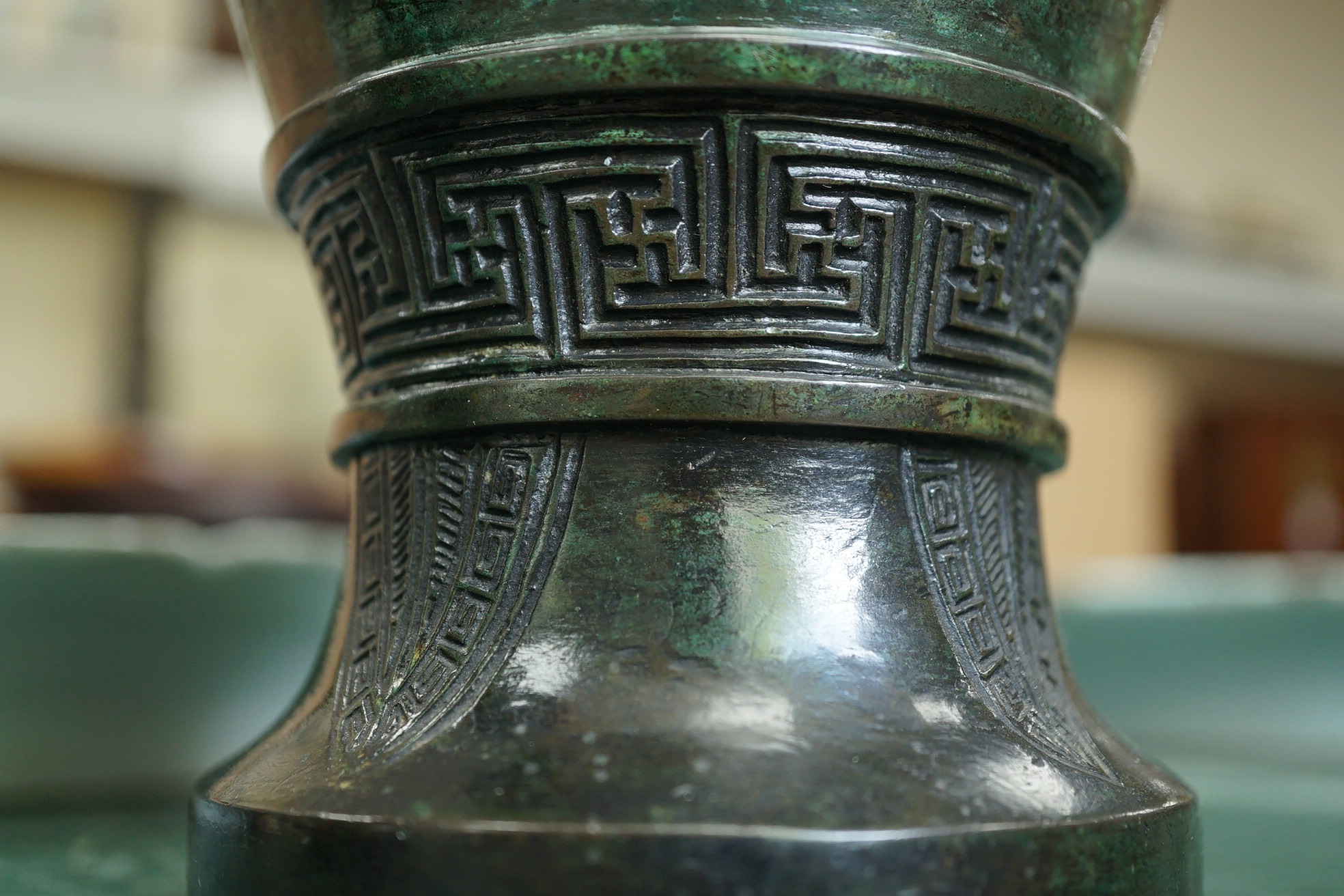 A pair of Chinese bronze gu-shaped vases, Qing dynasty